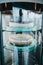 Vertical shot of cakes in a glass showcase of a modern bakery