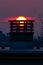 Vertical shot of a chimney of a building with the stunning view of sunset in the background