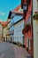 Vertical shot of colorful buildings on a paved street in Fussen, Germany
