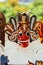 Vertical shot of colorful masks on display in a roadside shop in Sri Lanka