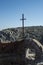 Vertical shot of a cross on the top of the wall in Riofrio, Avila, Spain