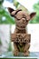 Vertical shot of a cute chihuahua statue with sunglasses and an \\\