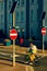 Vertical shot of a cyclist in a driving motion between two stop signs