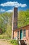 Vertical shot of a dairy with a chimney