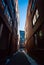 Vertical shot of a dark narrow street in Griffintown in Montreal, Canada