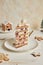 Vertical shot of a delicious Christmas cake with gingerbread decorations and coconutâ€“almond ball