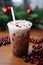 Vertical Shot. Delicious Iced Coffee Milkshake with Festive Christmas Decorations
