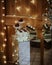 Vertical shot of a dessert corner of a decorated restaurant with sweets put on a mirror table