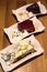 Vertical shot of different types of cakes on a wooden table