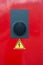 Vertical shot of a dimmer with a warning sign of  danger of electric shock\'
