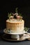 Vertical shot of a dreamy cake with white cream and orange drip with a forest and reindeers on top