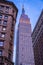 Vertical shot of the Empire state building in the evening time