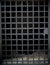 Vertical shot of an empty cage door with a metal lock