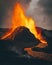 Vertical shot of exploding burning lava near a volcano