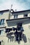 Vertical shot of the facade of an apartment building with hanging laundry