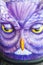 Vertical shot of a fake purple owl design