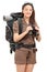 Vertical shot of a female hiker holding binoculars