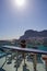 Vertical shot of a female looking at the ocean from a glass patio in Gibraltar