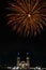 Vertical shot of fireworks in front of church during city's holidays of Tuxpan, Jalisco, Mexico
