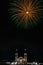 Vertical shot of fireworks in front of church during city's holidays of Tuxpan, Jalisco, Mexico