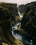 Vertical shot of Fjaorargljufur, a beautiful dramatic canyon in South Iceland