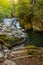 Vertical shot of the flowing Cubo waterfall in Ochagavia, Spain