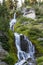 Vertical shot of the flowing Upper Vidae Falls in Crater Lake National Park, Oregon