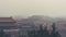 Vertical shot of the Forbidden City in Beijing China, on a foggy