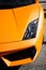 Vertical shot of the front of an orange luxurious Lamborghini Gallardo car