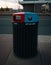 Vertical shot of a garbage bin separated between trash and bottles and cans.