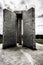 Vertical shot of the Georgia Guidestones in Elberton, showing English, Russian, and cuneiform texts