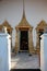 Vertical shot of a gilded door at the Grand Palace in Bangkok, Thailand