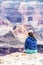 Vertical shot of a girl hiker gazing at the mountains at the Grand Canyon, Arizona, USA