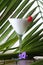 Vertical shot of a glass of pina colada with a cherry on top on the table