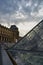 Vertical shot of the glass pyramid in front of the  Louvre Museum square in Paris, France