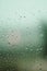 Vertical shot of a glass with raindrops forming the perfect autumn background