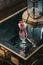 Vertical shot of a glass of strawberry smoothie on a table in a restaurant