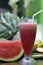 Vertical shot of a glass of watermelon juice