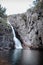 Vertical shot of Gorg Negre waterfall in Catalonia