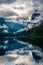 Vertical shot of the Gosauseen lake with mountains in the background in Austria