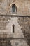 Vertical shot of gothic windows at the wall of the cathedral in Lamego City, Portugal