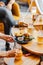 Vertical shot of a gourmet fast food restaurant table with burgers, fries, and drinks