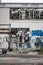 Vertical shot of graffiti art on an abandoned building in the streets of Montreal, Canada