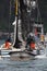 Vertical shot of a group of fishermen on the sailing boat in Alaska