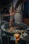 Vertical shot of a hand frying chopped meat on the frying pan