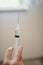 Vertical shot of a hand holding a syringe