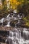 Vertical shot of a high cascading waterfall at Vogel state park in Georgia.