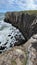 Vertical shot of high cliffs and a sea in Morro Da Guarita, Torres, Brazil