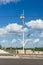 Vertical shot of a high post with lamps and electric cables on the Most Rocha bridge in Poland