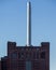 Vertical shot of a high white  chimney of an old factory